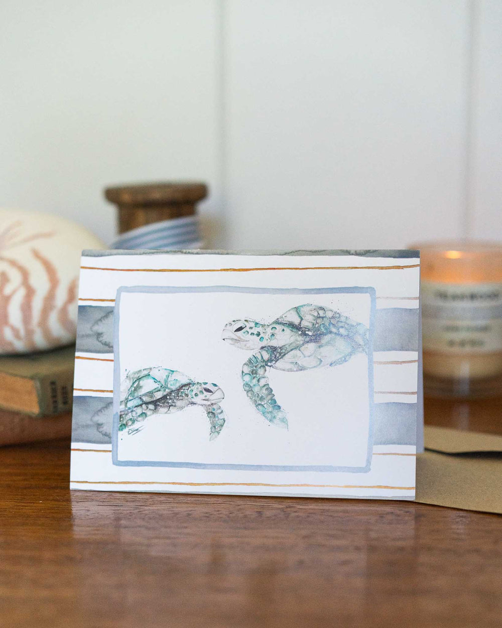 Better Together greeting card featuring illustrated sea turtles swimming together on a light background.