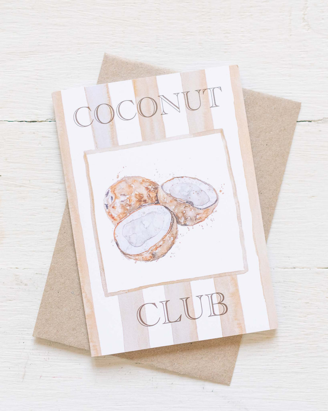 Coconut Club Greeting Card featuring cracked coconuts, paired with a brown envelope.