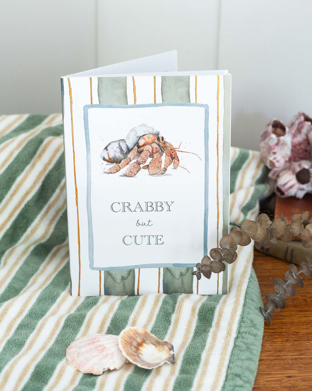 A5 lined notebook with a cheerful crab illustration and “Crabby but Cute” title on the cover.
