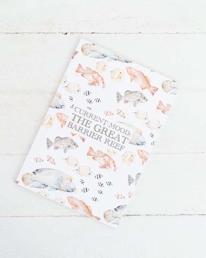 A5 lined notebook with reef fish illustration and “Current Mood: The Great Barrier Reef” on the cover.