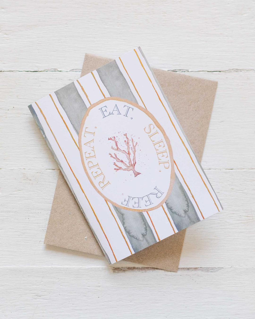 Eat Sleep Reef Repeat greeting card with coral illustration and brown envelope.