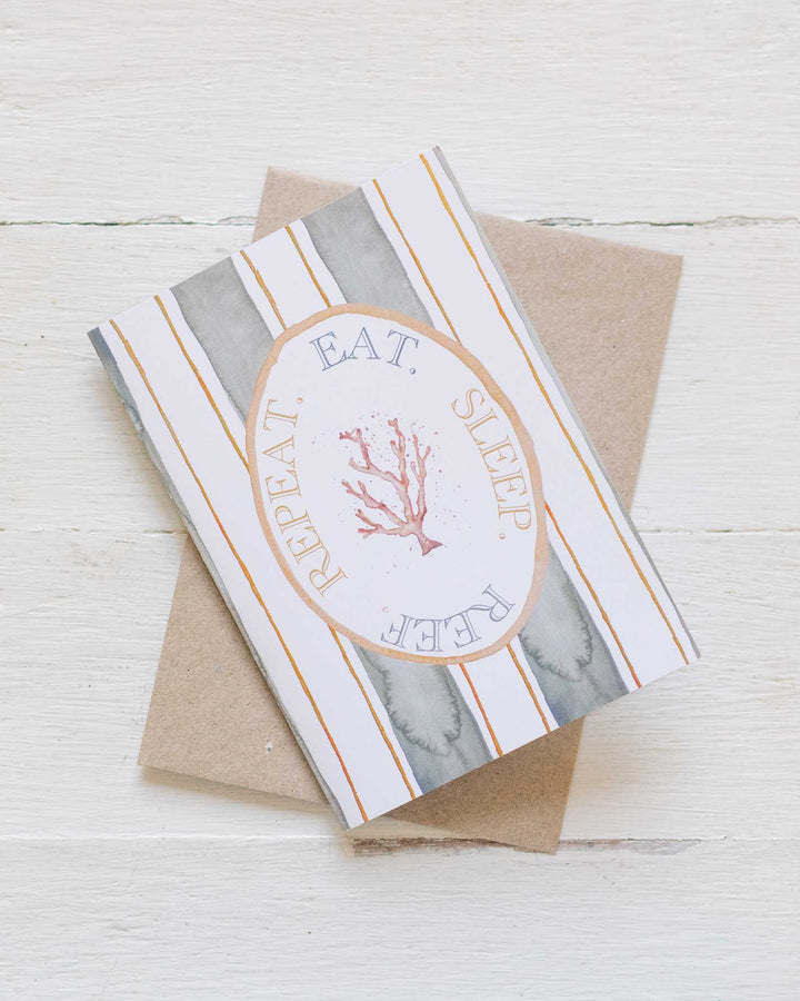Eat Sleep Reef Repeat greeting card with coral illustration and brown envelope.