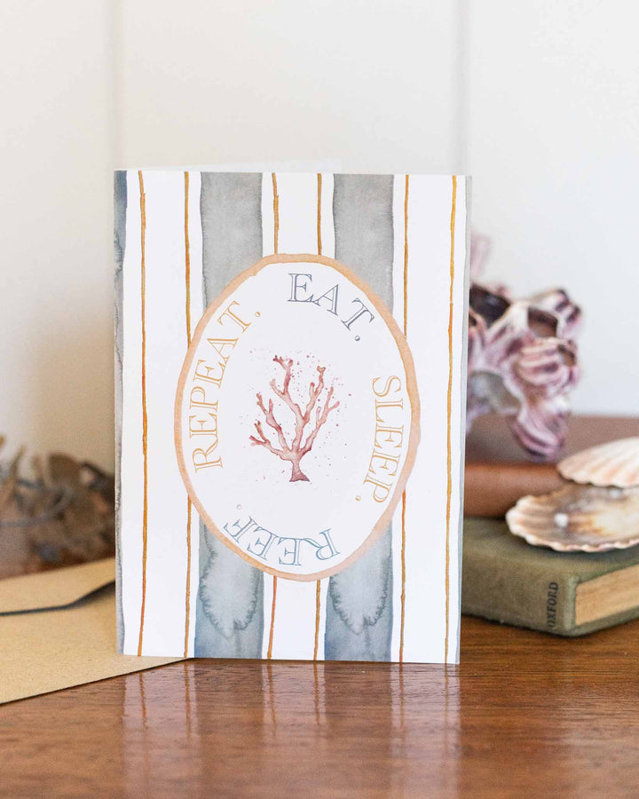 Eat Sleep Reef Repeat card with coral illustration and the phrase: EAT. SLEEP. REEF. REPEAT.