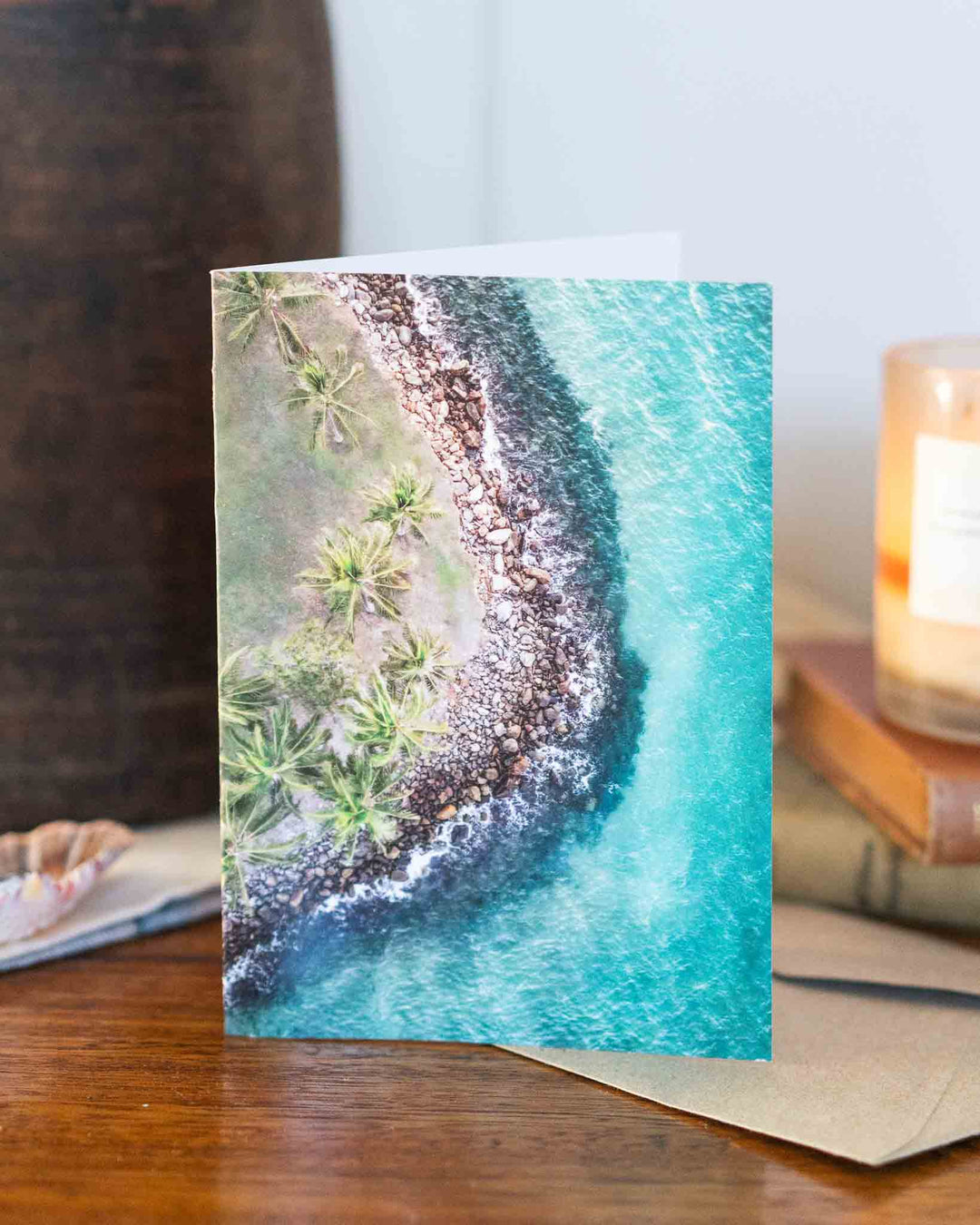 Hammocks and Hangouts Greeting Card featuring an aerial shoreline view, printed on recycled paper.