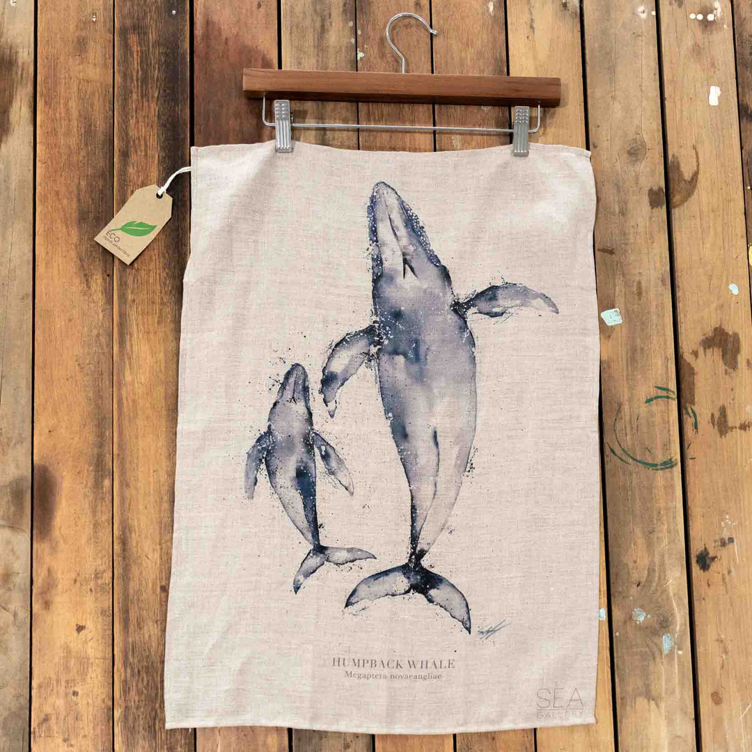 Watercolor of two graceful humpback whales on a linen tea towel, Whales design by Stephanie Elizabeth.