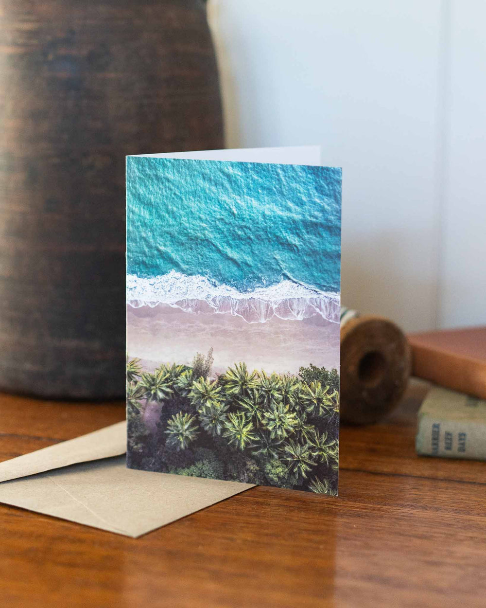 On The Nature of Daylight greeting card showing beach waves and palm trees on the cover.