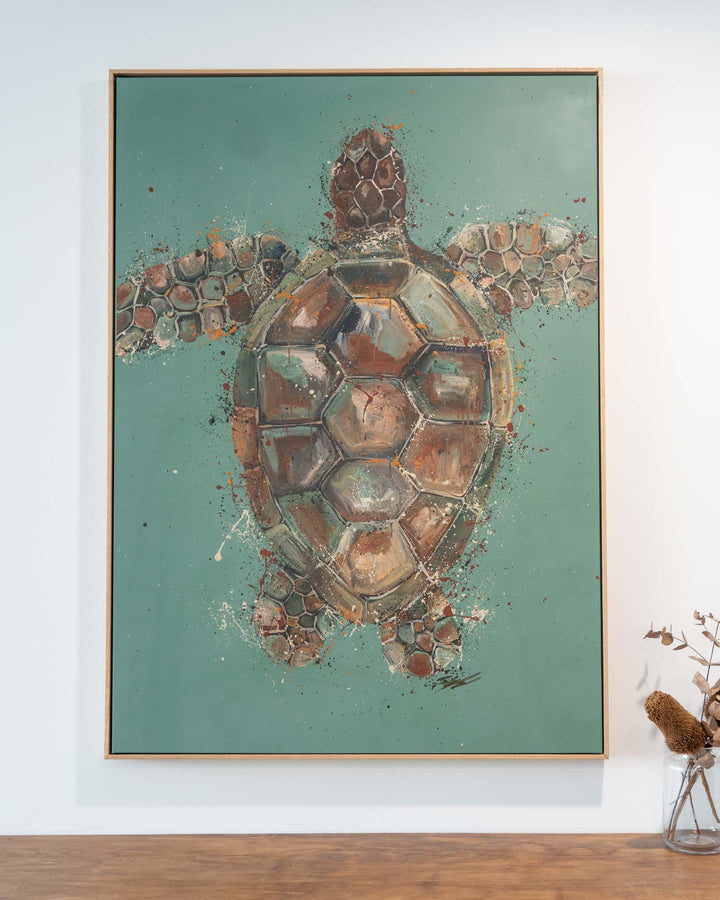 Running on Good Vibes“ artwork above a wooden surface, next to a vase holding dried flowers.