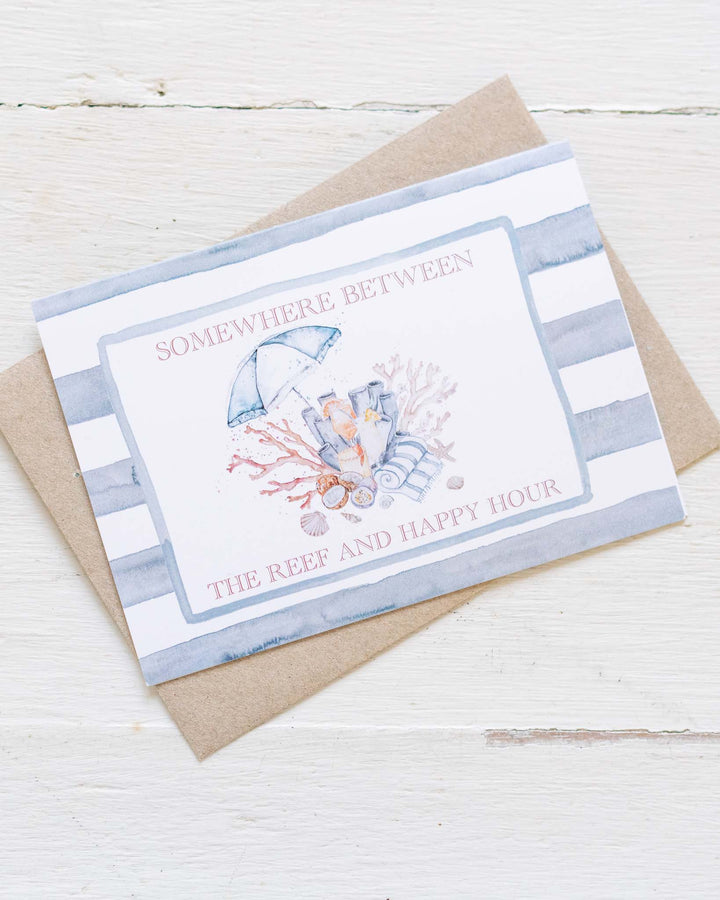 “Somewhere Between the Reef and Happy Hour” card with a matching striped envelope.