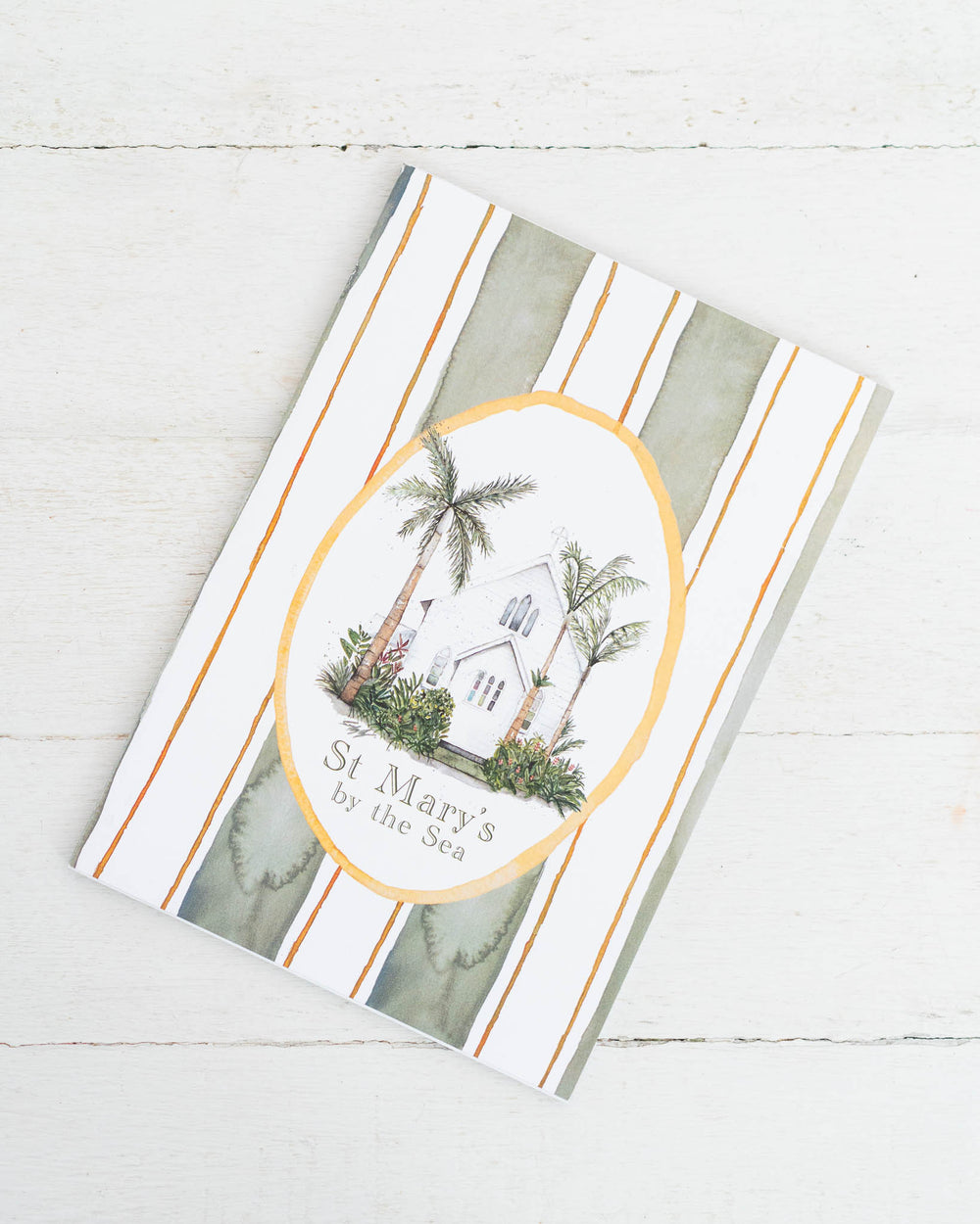 St Mary’s by the Sea A5 lined notebook with church and palm tree illustration on the cover.