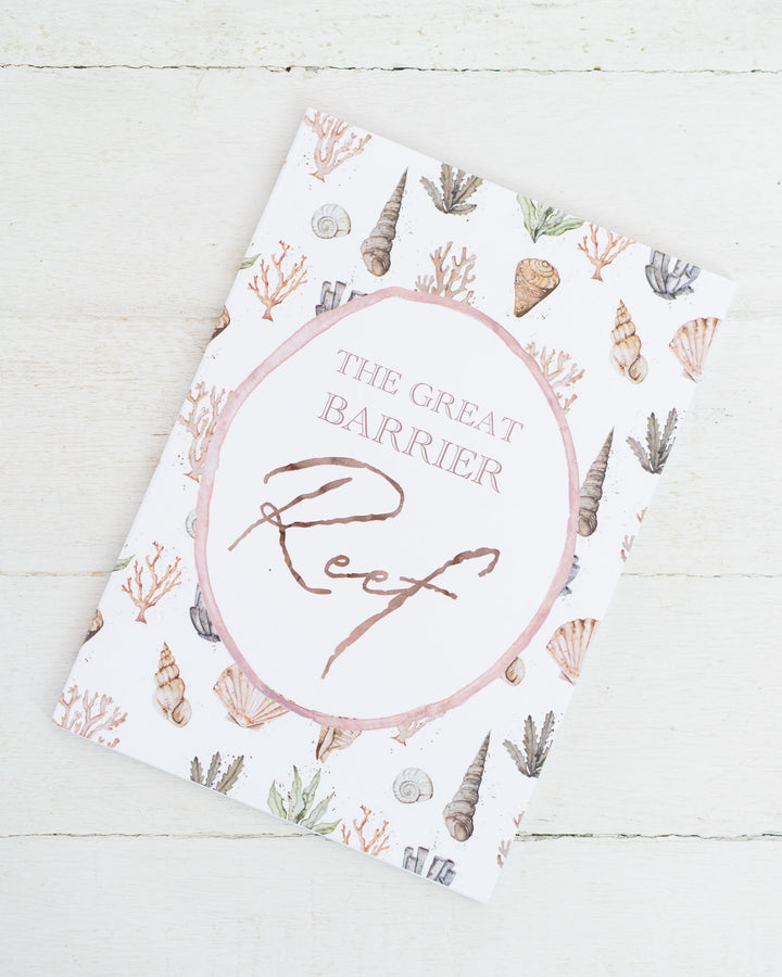 The Great Barrier Reef A5 lined notebook with seashell and coral illustrations on a white background.