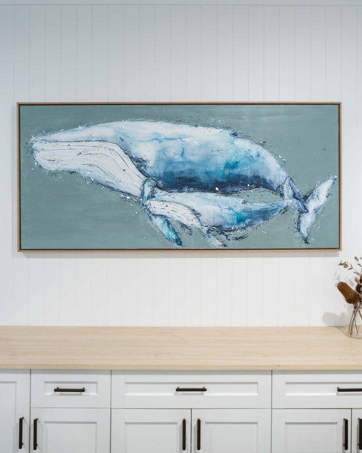 A Life Growing Together“ hangs above white cabinets topped with a wooden countertop.