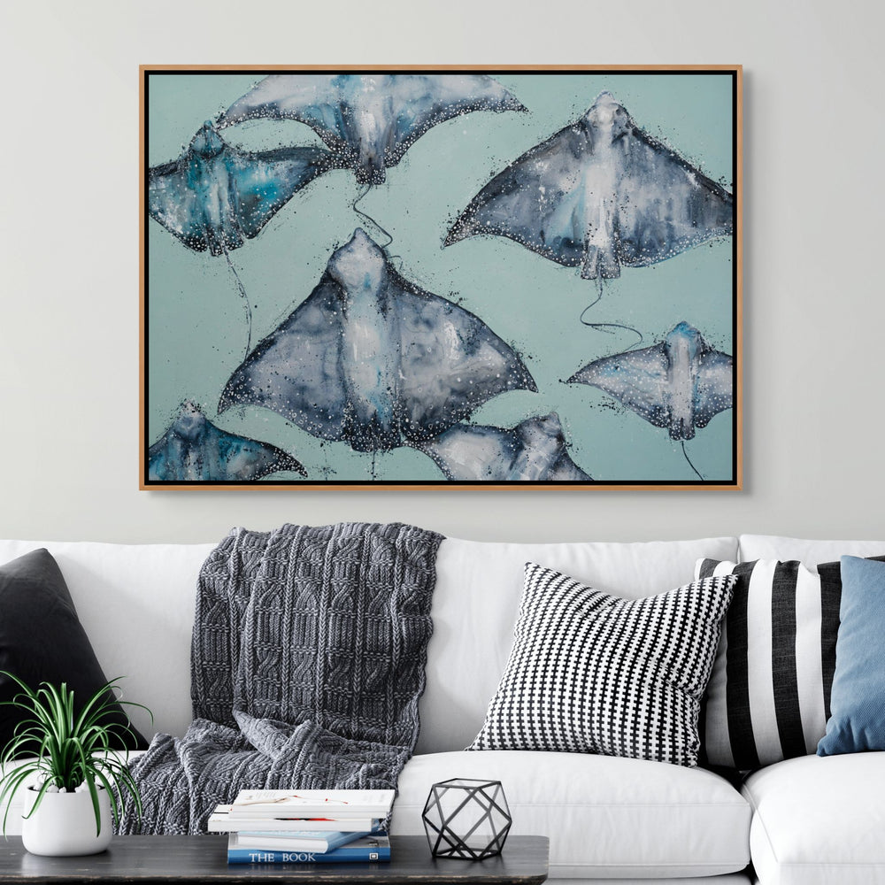 A Sea of Spots by Stephanie Elizabeth – shadow box canvas print of eagle rays swimming across teal background, ocean-inspired artwork