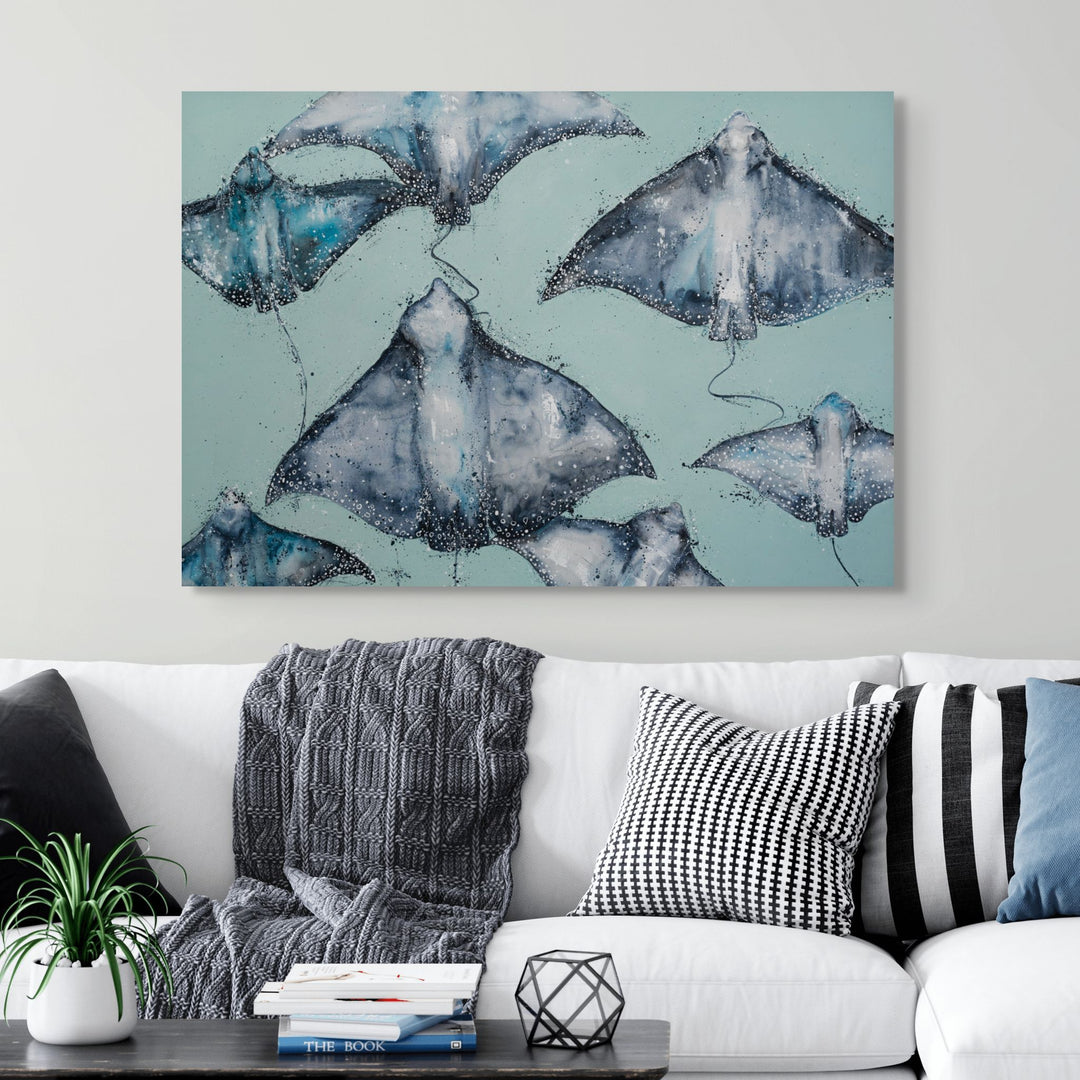 A Sea of Spots by Stephanie Elizabeth – stretched canvas print of spotted eagle rays with teal background, fine art marine print