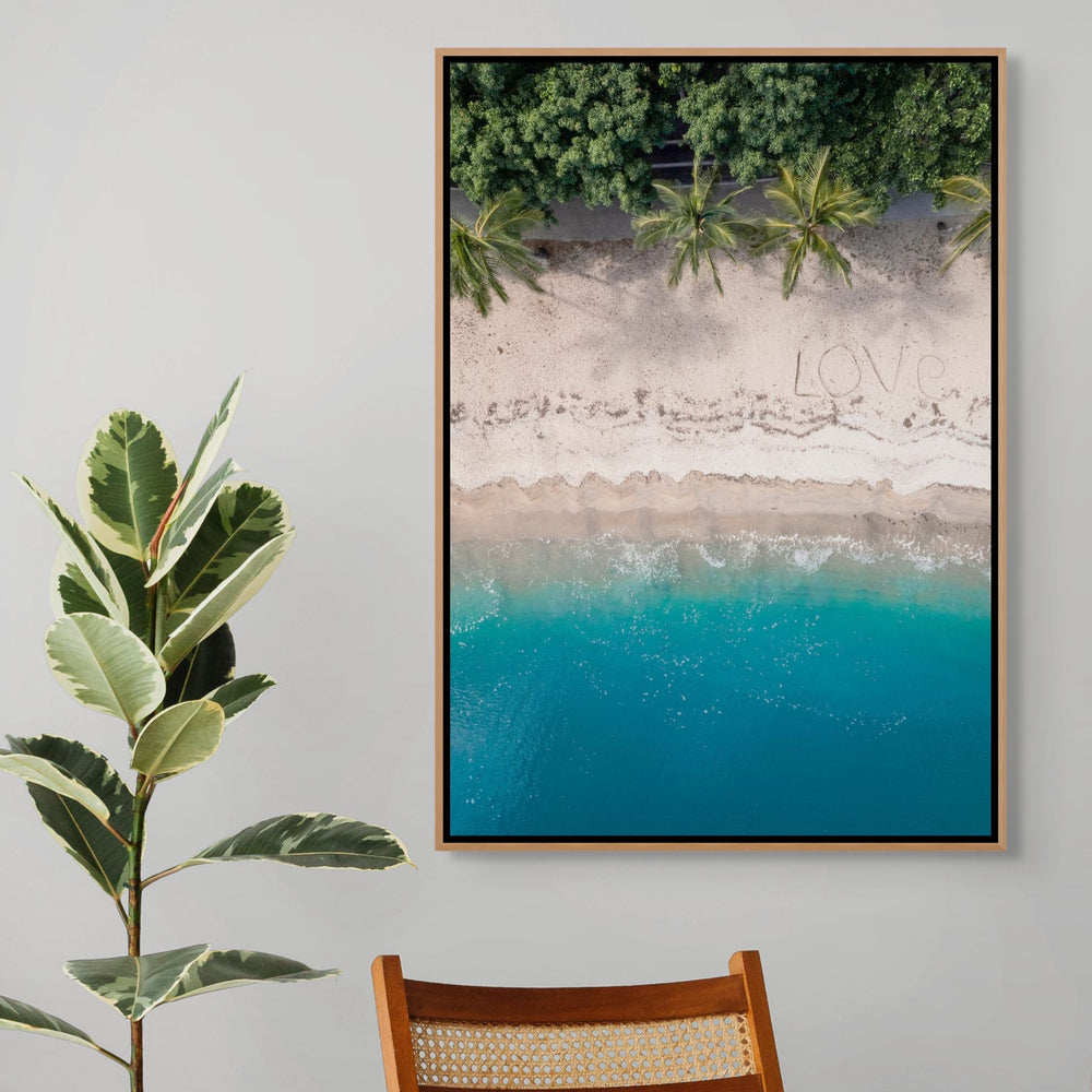 All You Need Is… – Aerial view of the Whitsundays with “Love” written on the beach, turquoise water and palm trees above and below | Shadow Box Canvas Print
