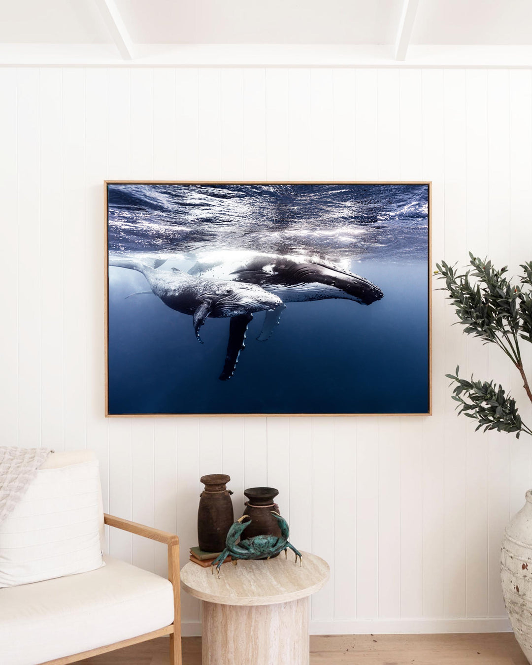 Framed fine art print of a humpback whale mother and calf swimming underwater, titled Along for the Ride.