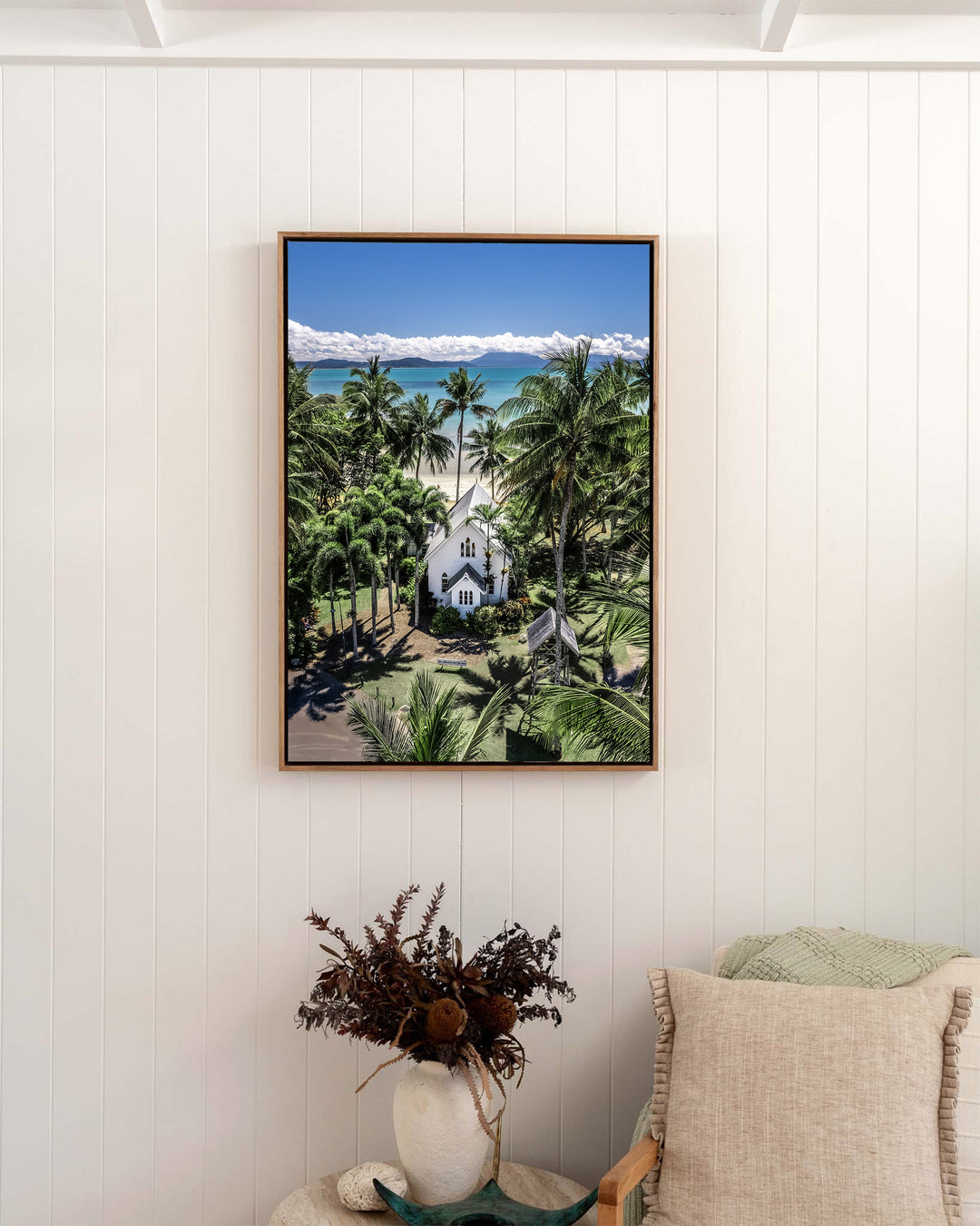 Always Forever – St Mary’s, Port Douglas, Aerial Photography by David Lloyd, framed canvas print in oak float frame, styled in a bedroom setting