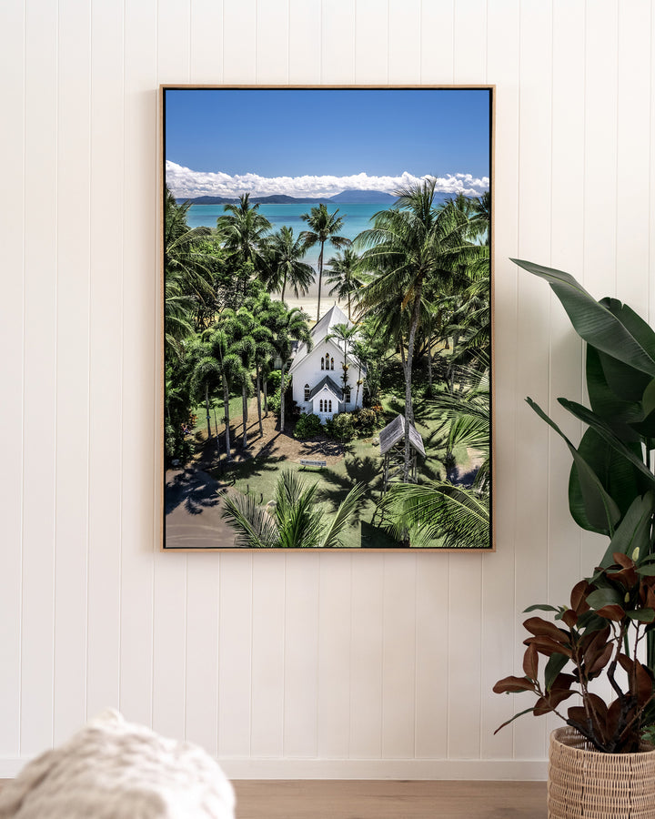 Always Forever – St Mary’s, Port Douglas, Aerial Photography by David Lloyd, framed canvas print in oak float frame, styled in a living room setting