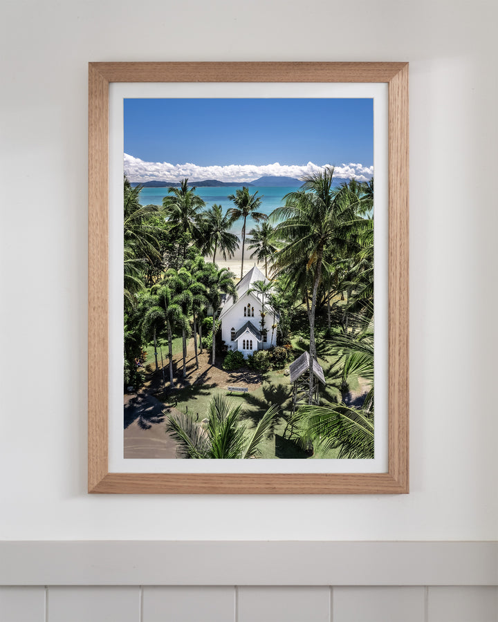 Framed Always Forever aerial print of the white St Mary’s church surrounded by tropical palm trees in Port Douglas.