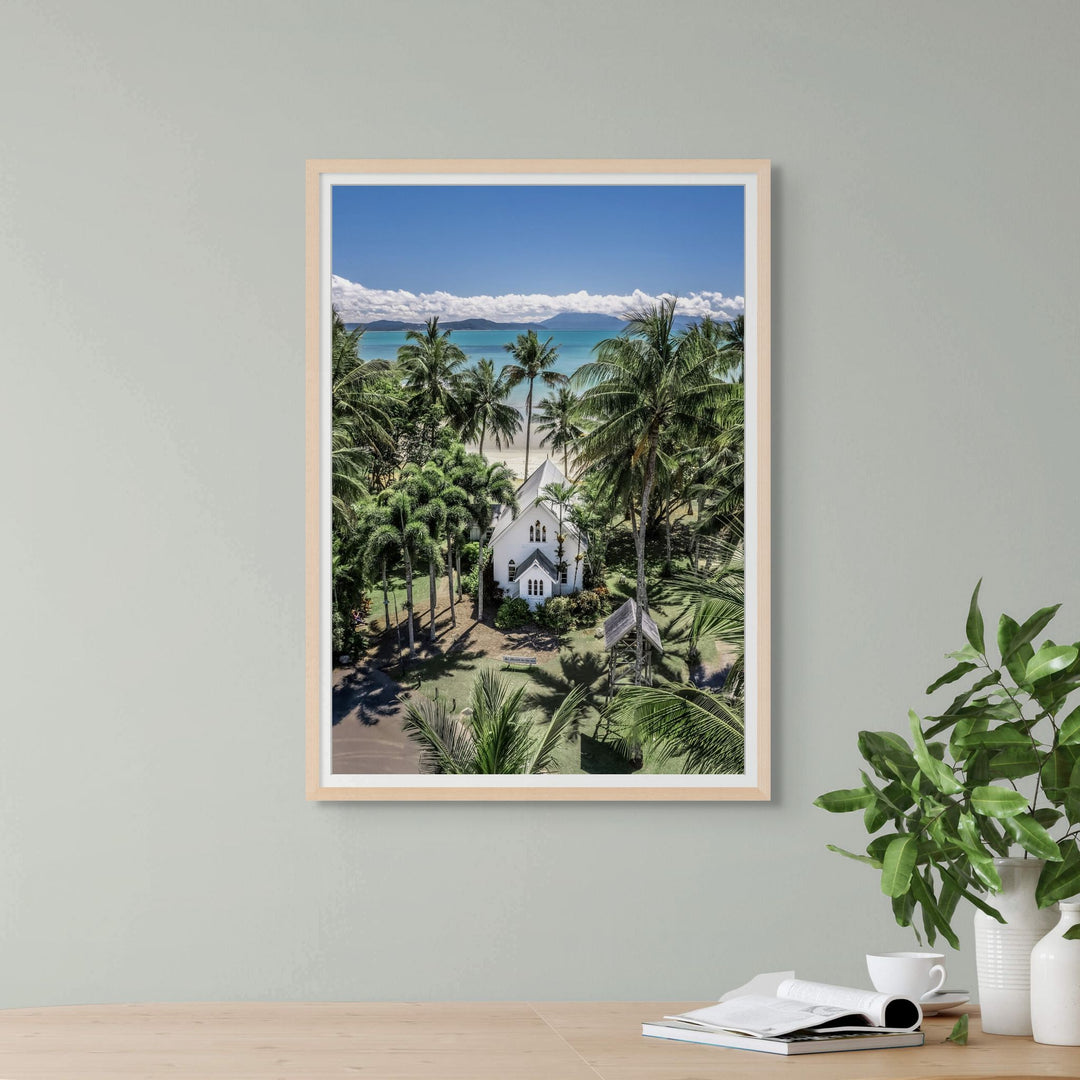Always Forever – Aerial portrait of St Mary’s, Port Douglas with blue skies, turquoise water, and high-contrast green tree line | Framed Paper Print