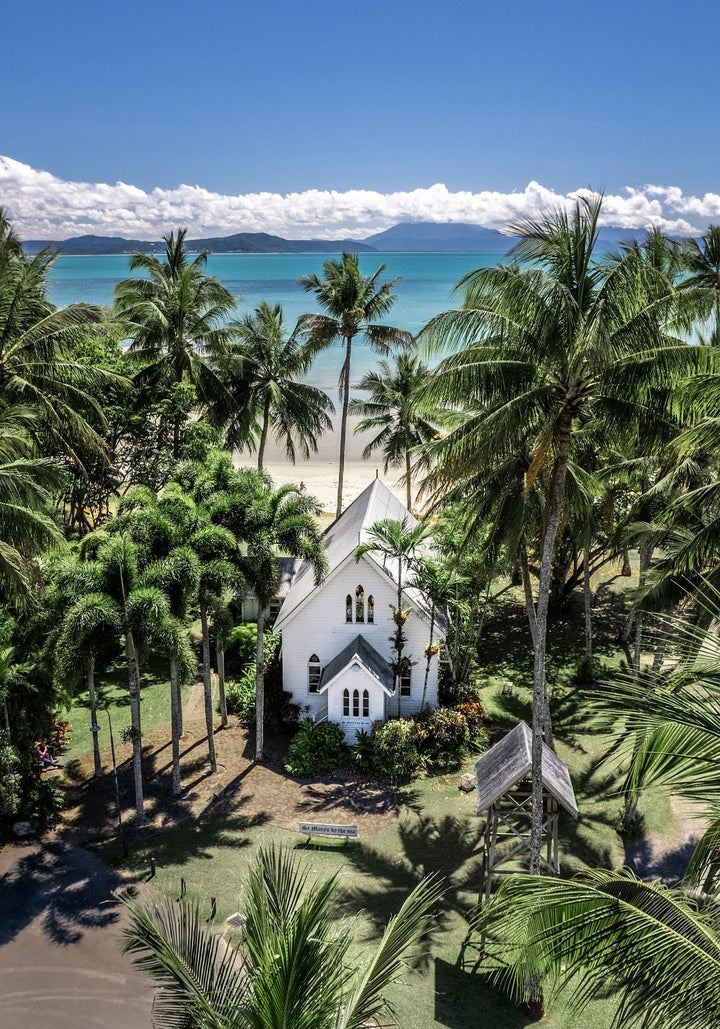 Always Forever – Aerial portrait of St Mary’s, Port Douglas with blue skies, turquoise water, and high-contrast green tree line | Unframed Rolled Print