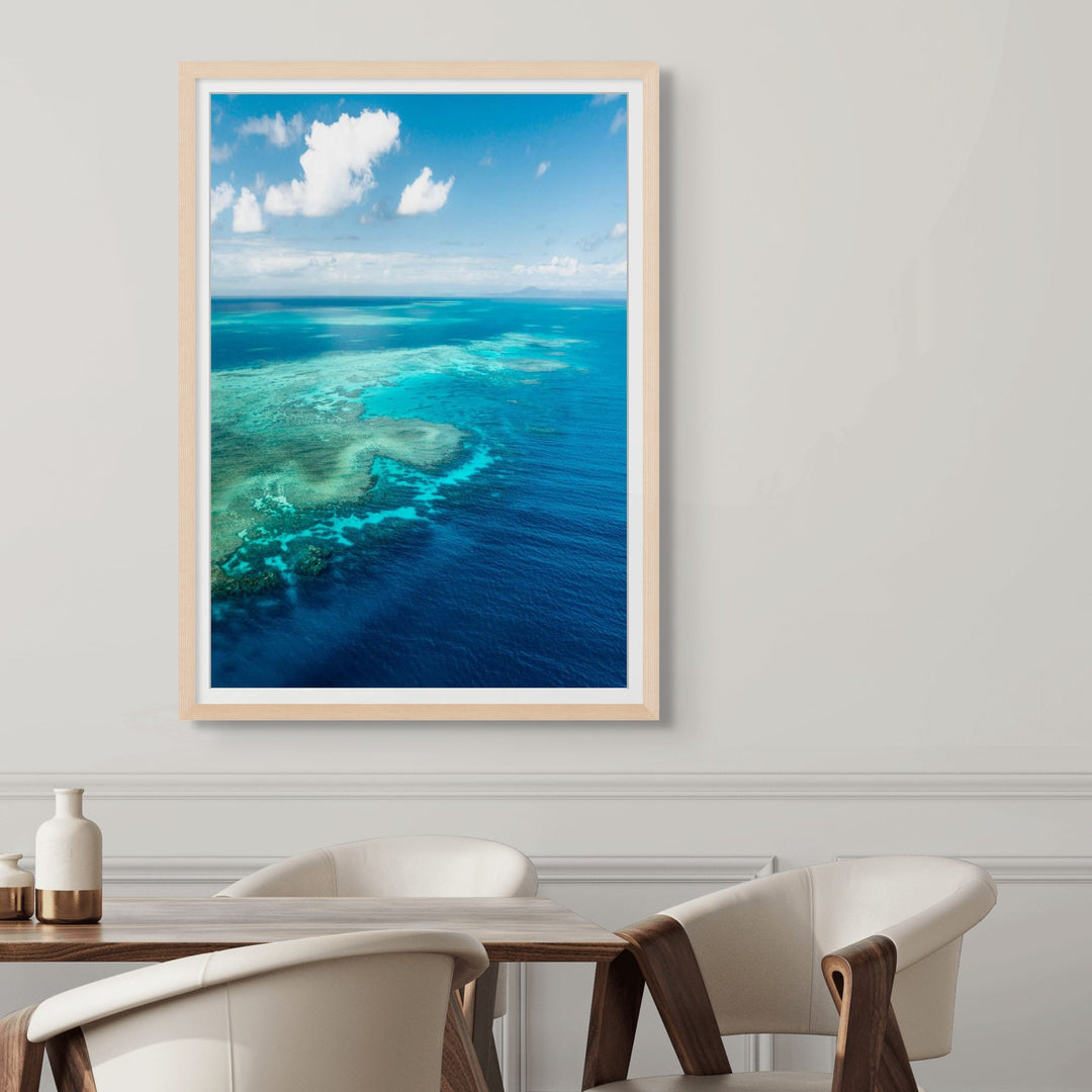 Always Take The Weather With You – Aerial view of Rudder Reef with turquoise waters and reef patterns | Framed Paper Print by David Lloyd