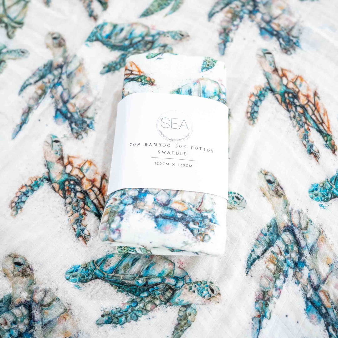 turtle swaddle flat lay