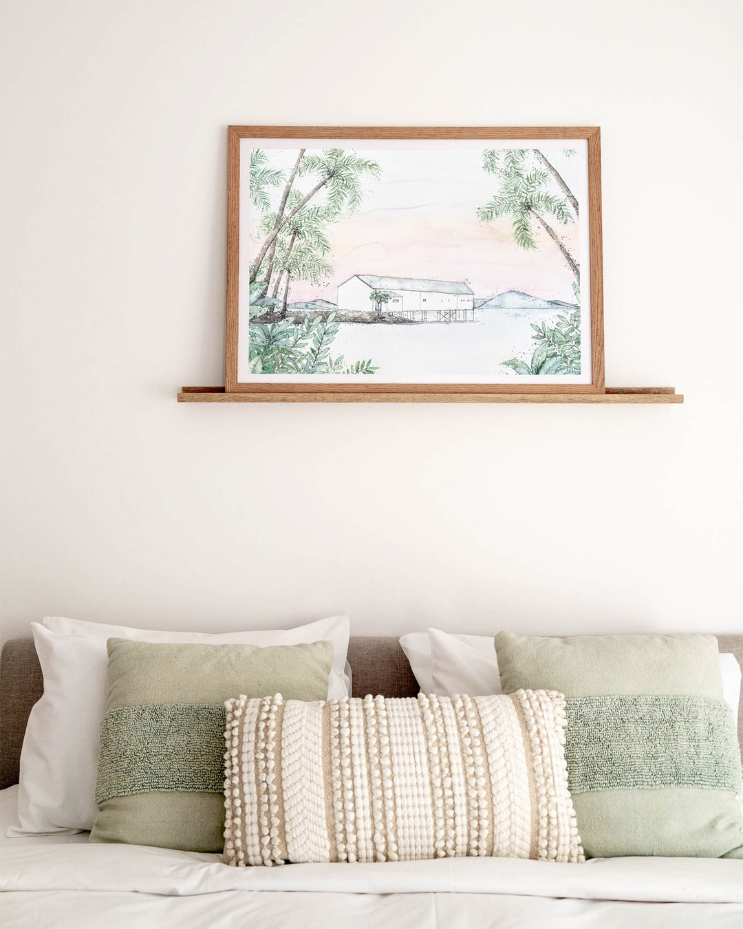 Balmy Beachside Sugar Wharf Port Douglas fine art print by Stephanie Elizabeth, framed paper print in an oak frame in a bedroom