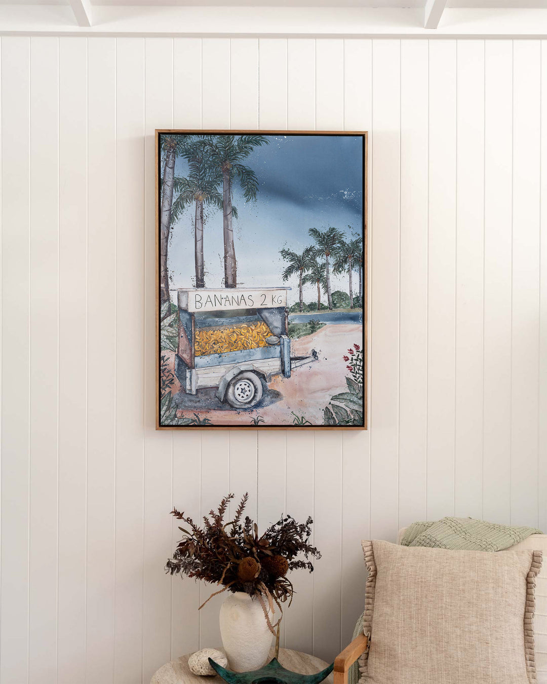 Banana Cart – tropical still life of a banana cart, framed canvas in oak float frame, styled in a bedroom