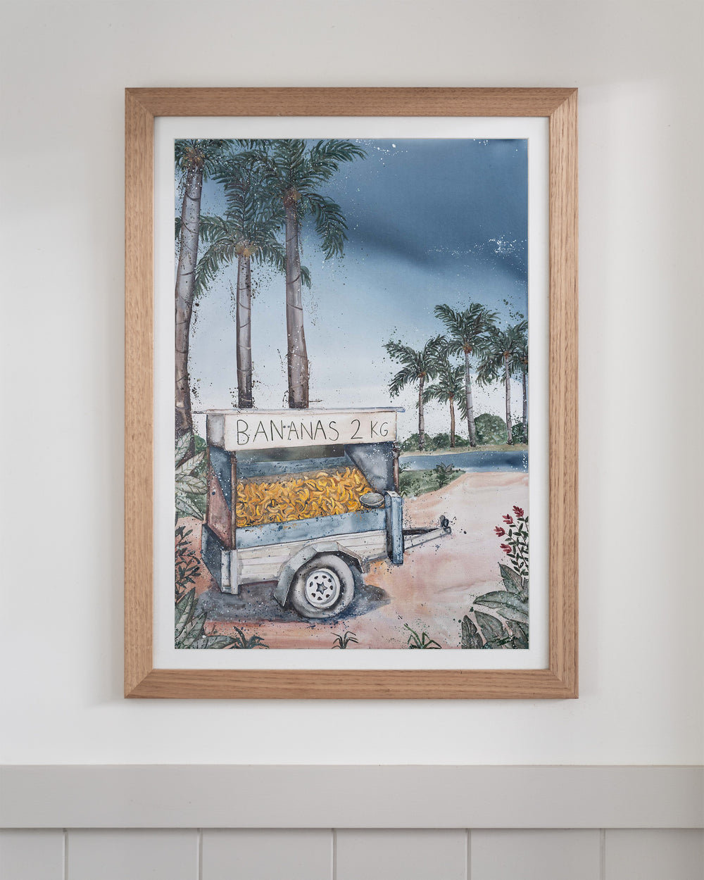 Banana Cart – tropical still life of a banana cart, framed paper print in oak frame
