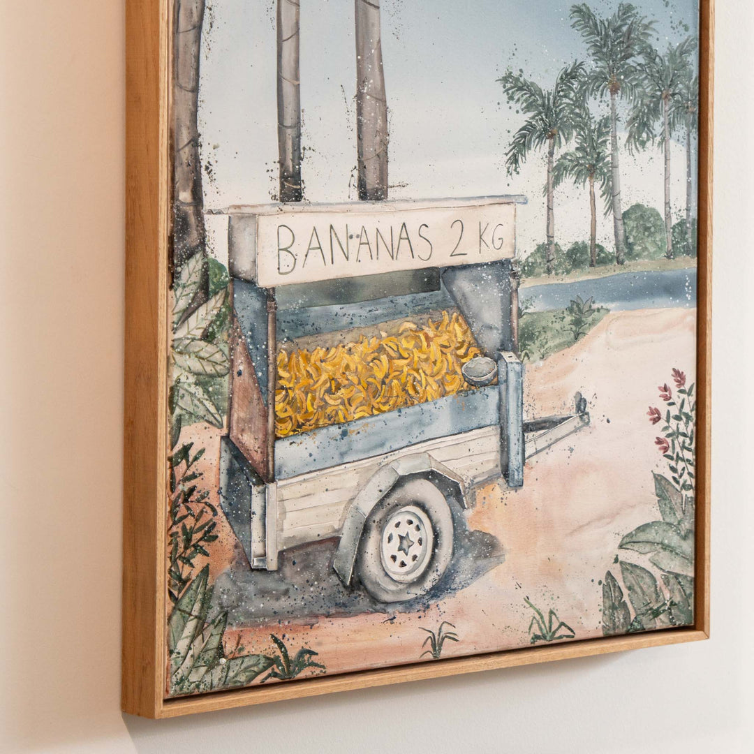 Banana Shack by Stephanie Elizabeth shows a banana trailer beside palm trees and a river, painted with acrylic on canvas.