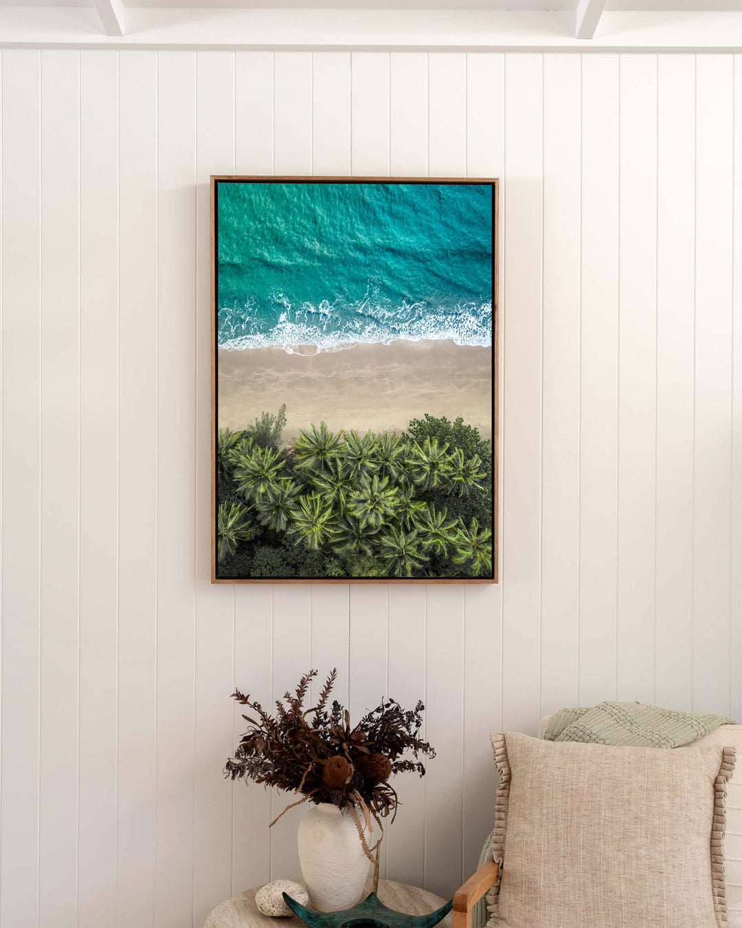 Beachside Reverie – Four Mile Beach, Aerial Photography by David Lloyd, framed canvas print in oak float frame, styled in a bedroom setting