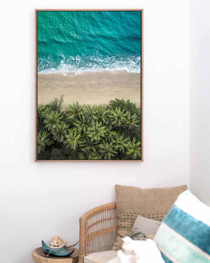 Beachside Reverie – Four Mile Beach, Aerial Photography by David Lloyd, framed canvas print in oak float frame, styled in a coastal lounge setting