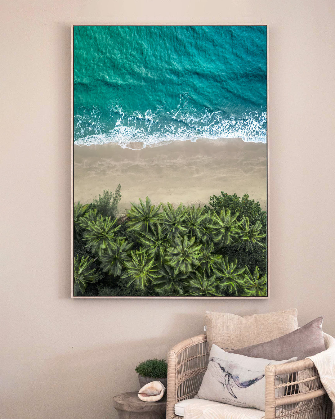 Beachside Reverie – Four Mile Beach, Aerial Photography by David Lloyd, framed canvas print in oak float frame, styled in a sitting room setting