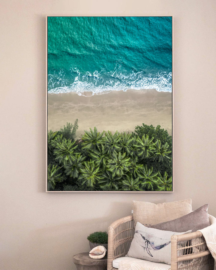Beachside Reverie – Four Mile Beach, Aerial Photography by David Lloyd, framed canvas print in oak float frame, styled in a sitting room setting
