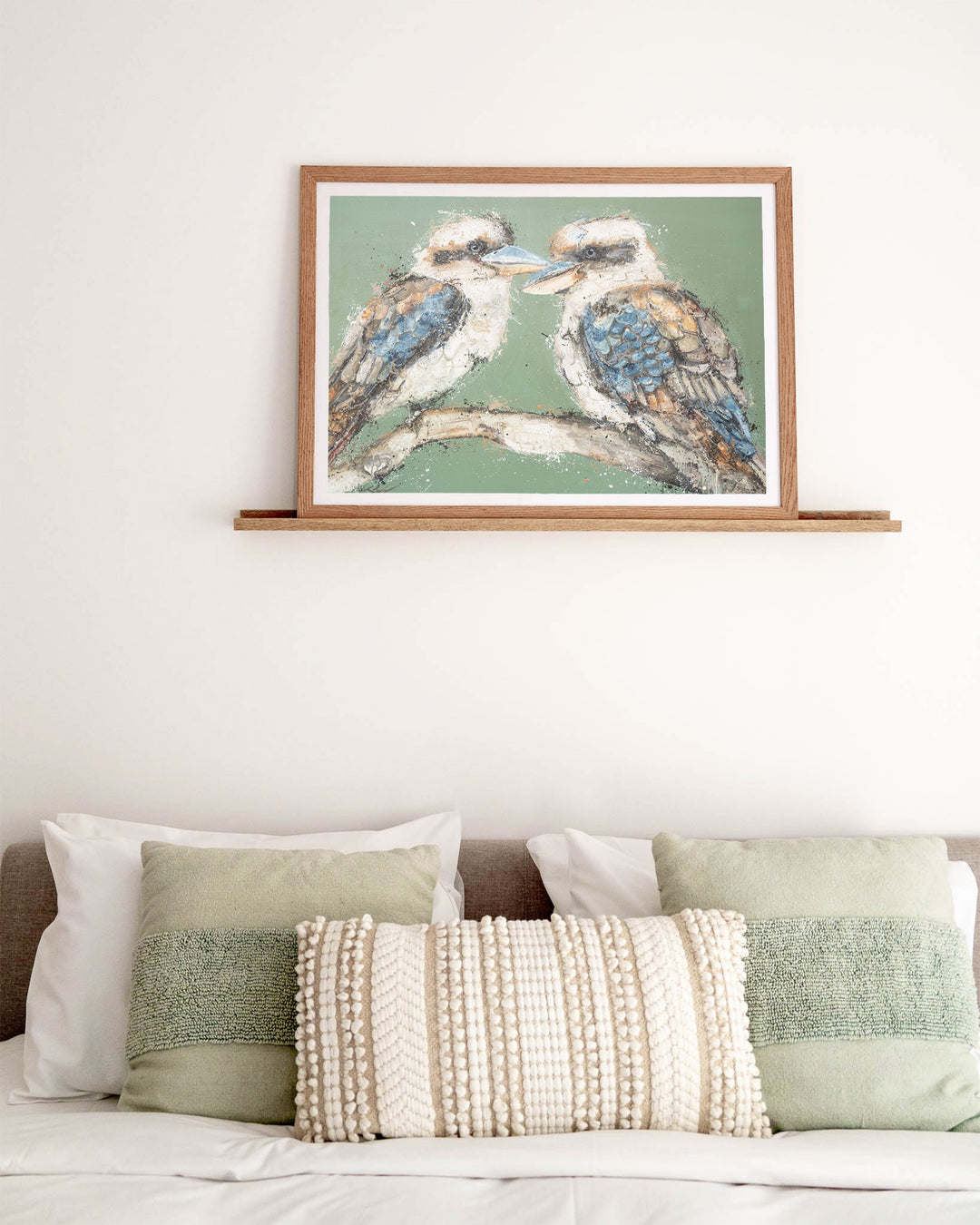 Beaks and Bedlam kookaburra fine art print by Stephanie Elizabeth, framed paper print in an oak frame in a bedroom