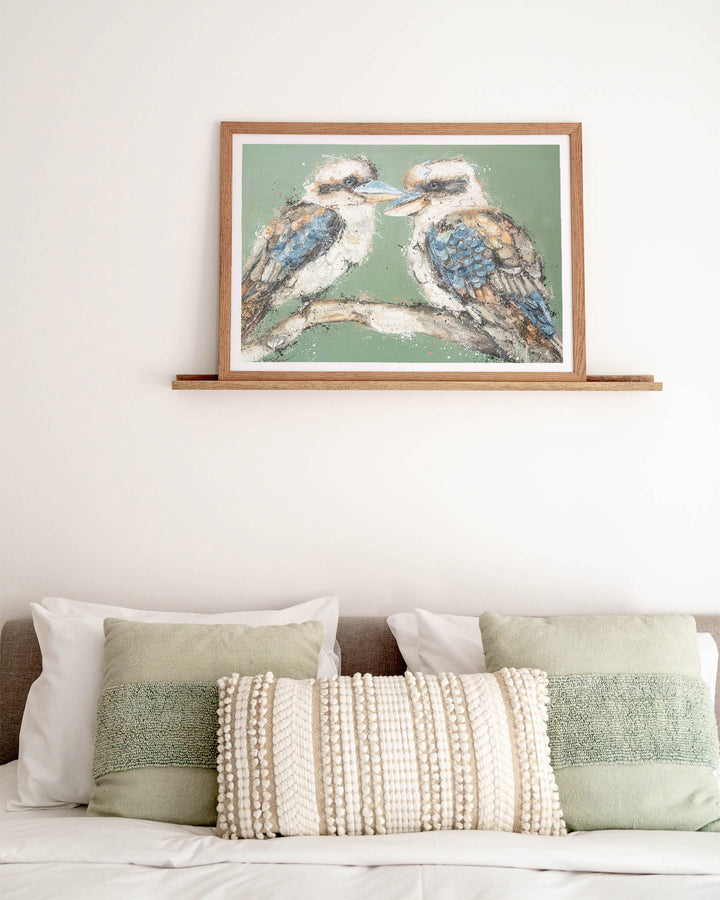 Beaks and Bedlam kookaburra fine art print by Stephanie Elizabeth, framed paper print in an oak frame in a bedroom