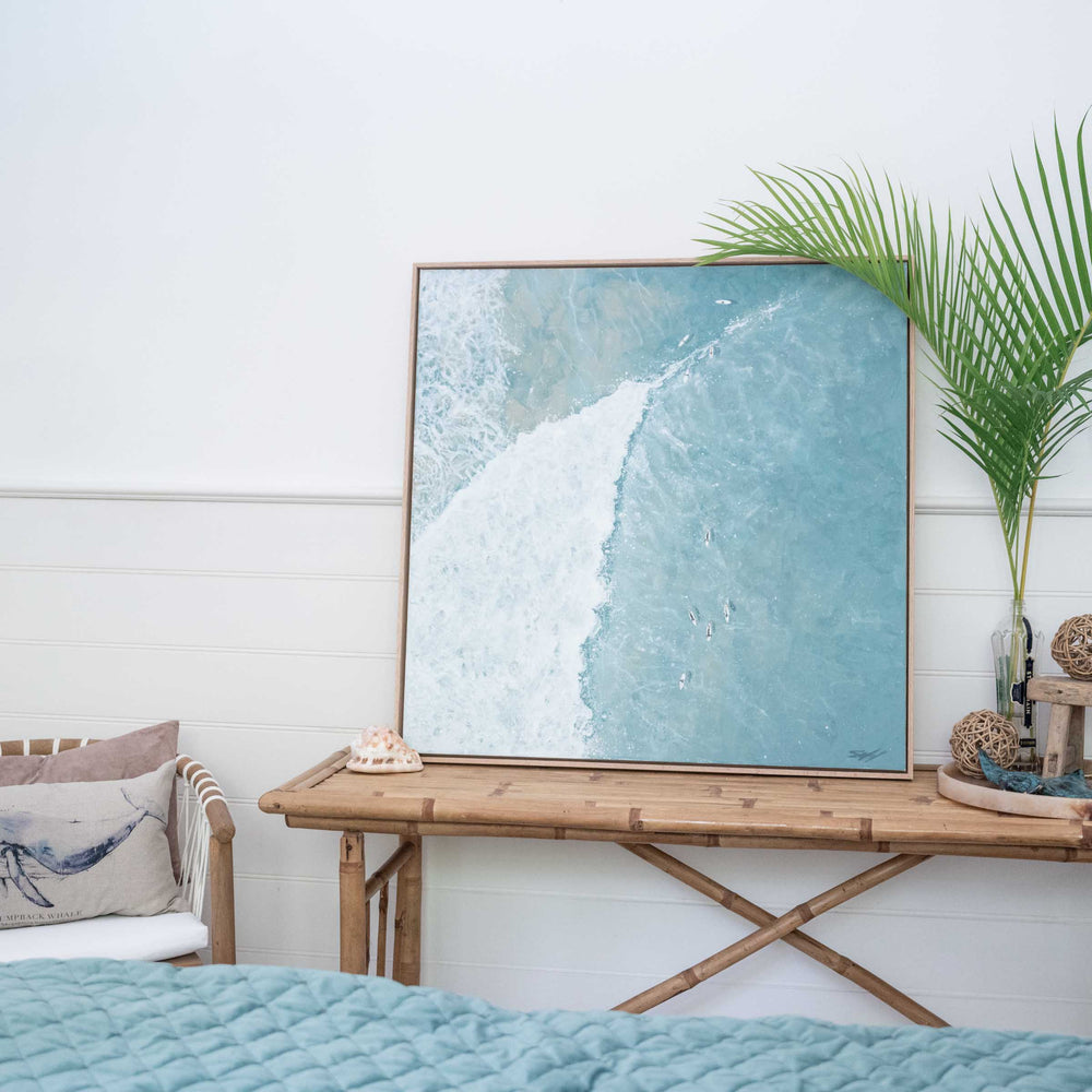 Beyond the Breakers – contemporary ocean painting with single wave and layered blue tones displayed in light interior setting by Stephanie Elizabeth | Original Artwork