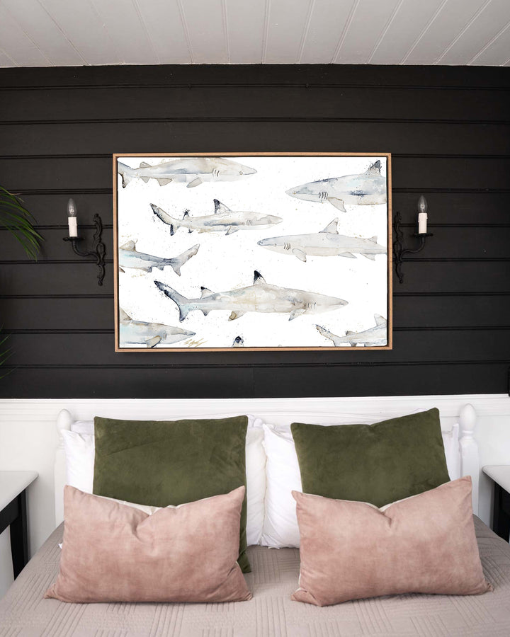 Black or White reef sharks fine art print by Stephanie Elizabeth, framed canvas in an oak frame in a bedroom
