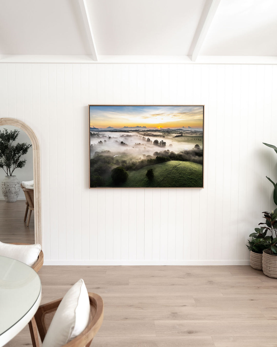 Campfire Smells and Fog Blankets – Atherton Tablelands, Aerial Photography by David Lloyd, framed canvas print in oak float frame, styled in a dining room setting