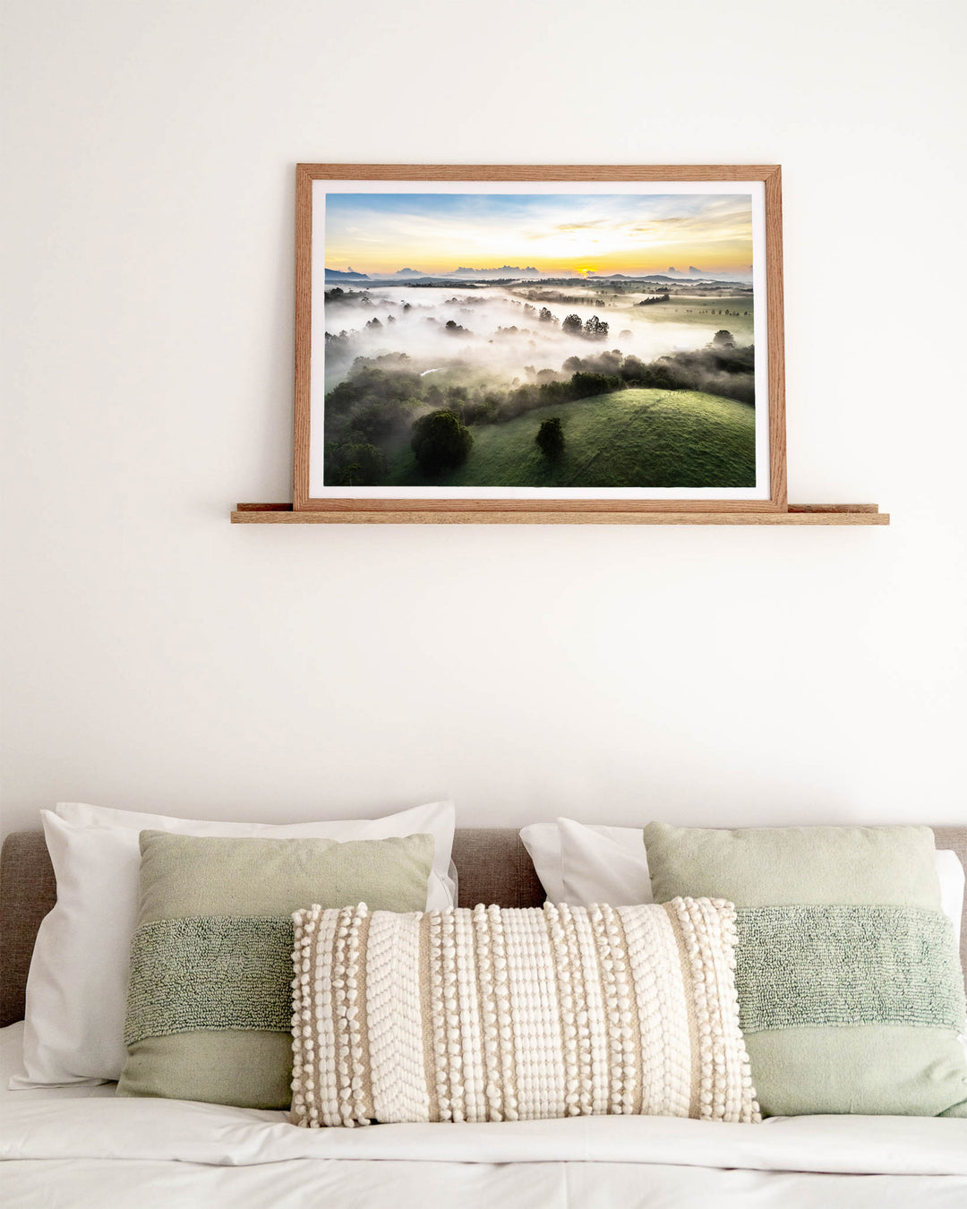 Campfire Smells and Fog Blankets – Atherton Tablelands, Aerial Photography by David Lloyd, framed paper print in oak frame, styled in a bedroom setting
