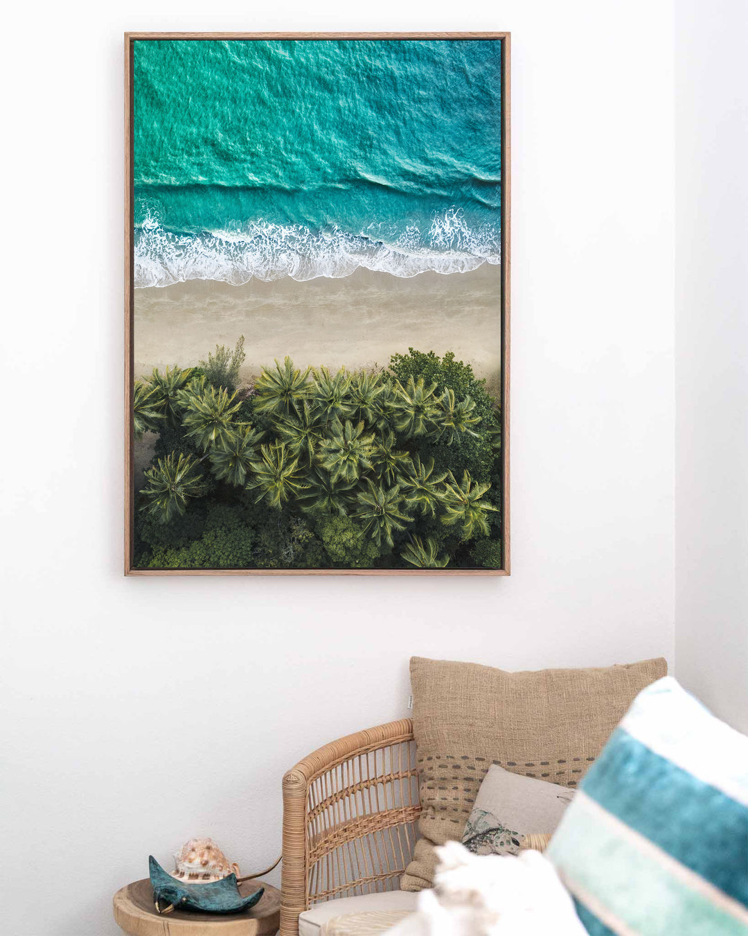 City of Palms – Four Mile Beach, Port Douglas, Aerial Photography by David Lloyd, framed canvas print in oak float frame, styled in a coastal lounge setting