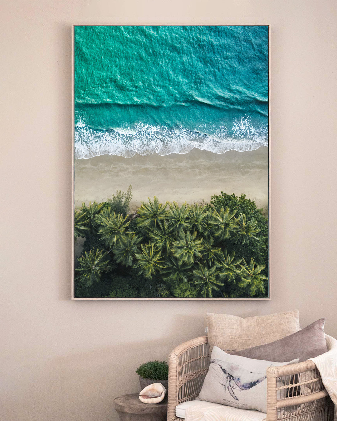 City of Palms – Four Mile Beach, Port Douglas, Aerial Photography by David Lloyd, framed canvas print in oak float frame, styled in a sitting room setting