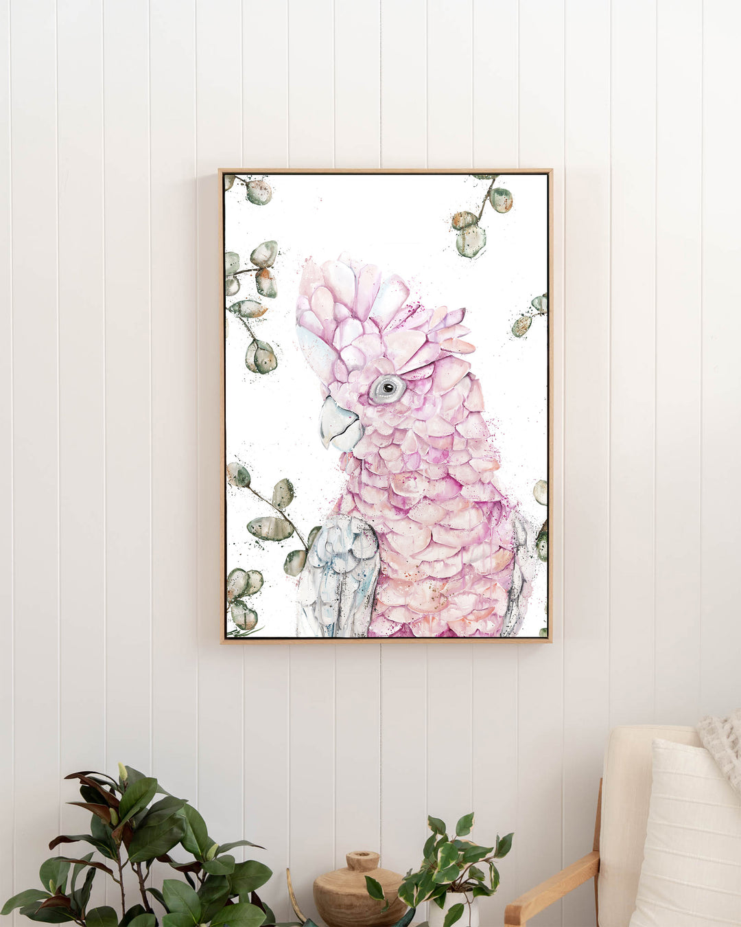 Coconut Ice pink galah fine art print by Stephanie Elizabeth, framed canvas in an oak frame in a hallway