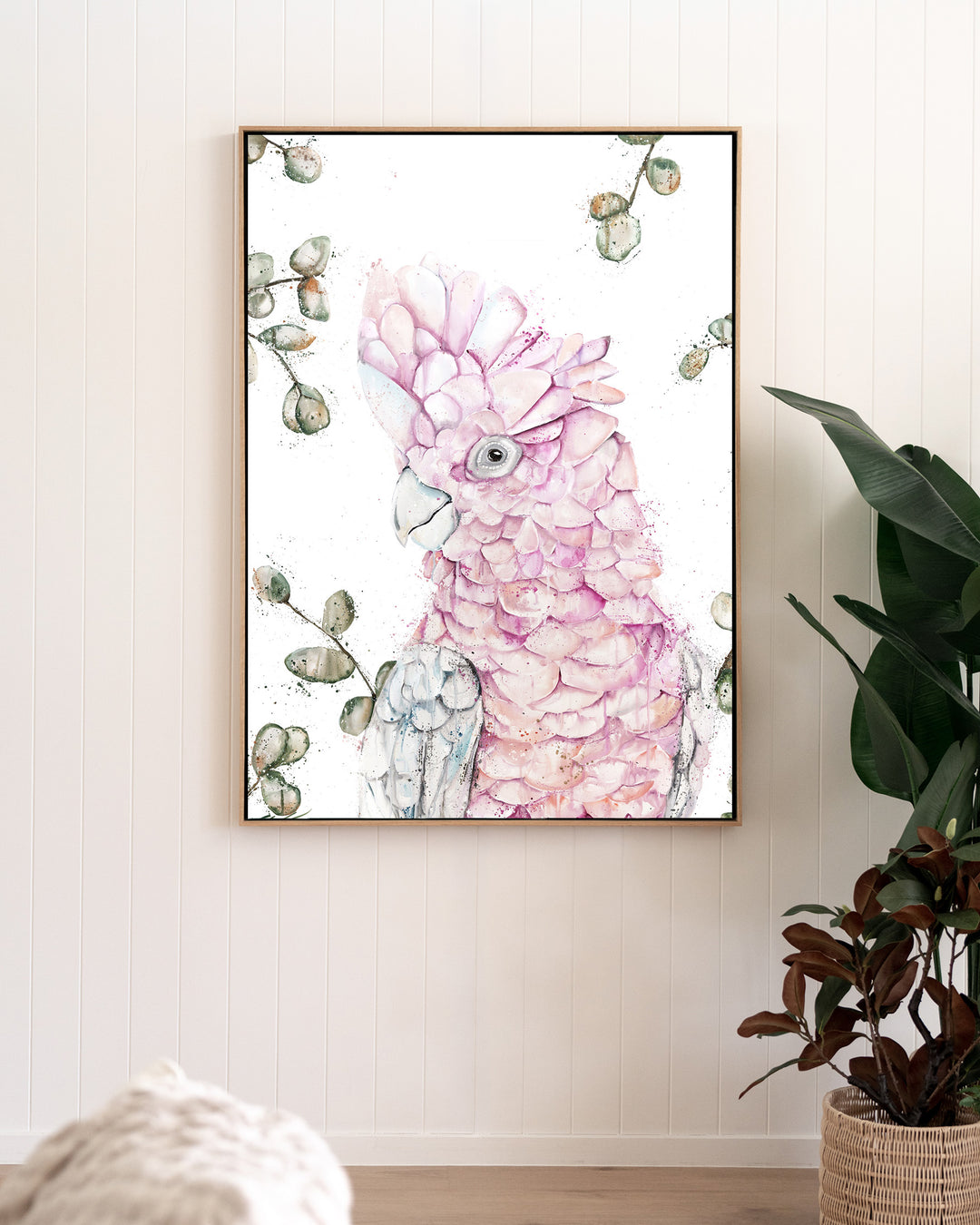Coconut Ice pink galah fine art print by Stephanie Elizabeth, framed canvas in an oak frame in a living room