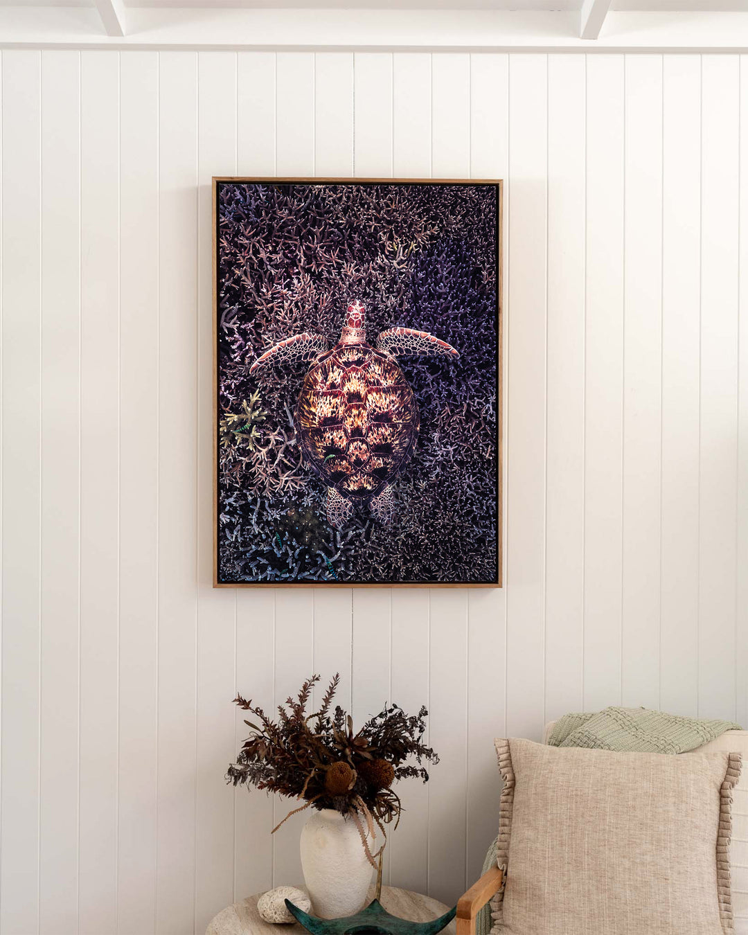 Coral Labyrinth – Green Sea Turtle, Underwater Photography by David Lloyd, framed canvas print in oak float frame, styled in a bedroom setting