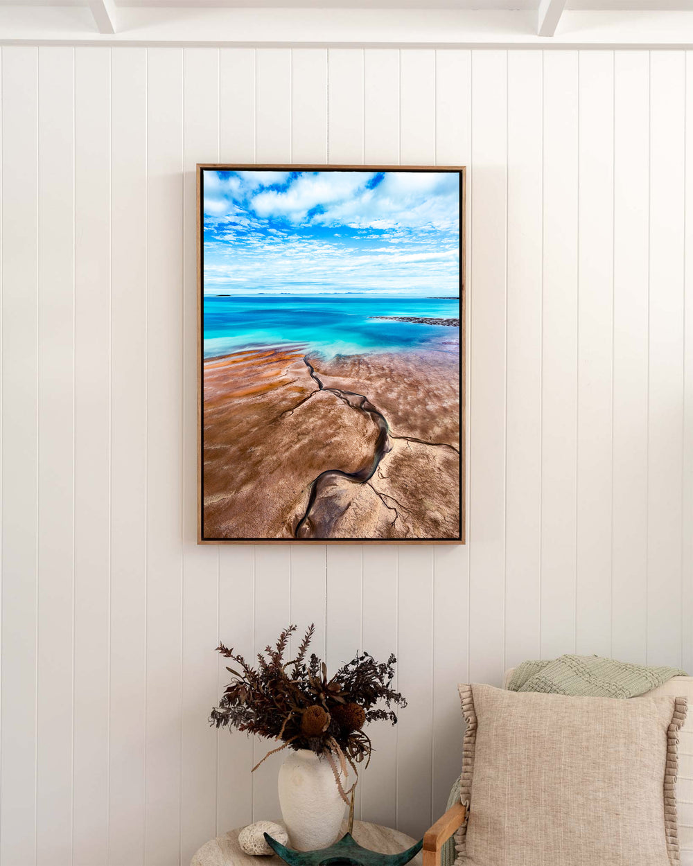 Cracks in the Ocean – Ocean Art, Aerial Photography by David Lloyd, framed canvas print in oak float frame, styled in a bedroom setting