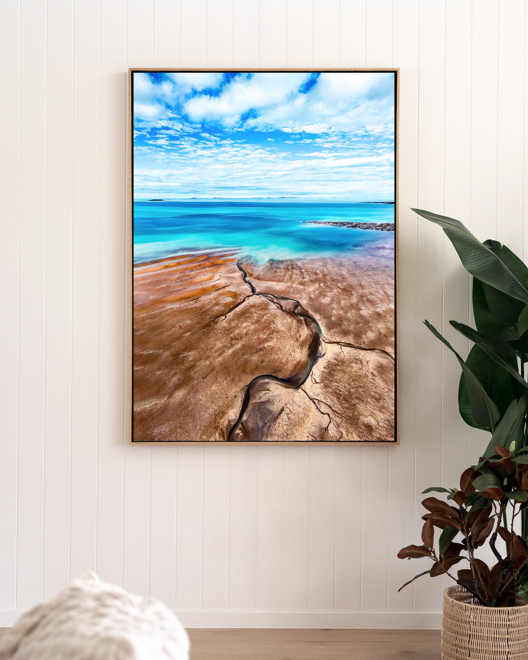 Cracks in the Ocean – Ocean Art, Aerial Photography by David Lloyd, framed canvas print in oak float frame, styled in a living room setting