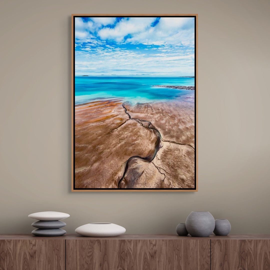 Cracks in the Ocean – Aerial view of textured brown sands and vivid blue ocean, low tide leading lines creating natural patterns | Shadow Box Canvas Print