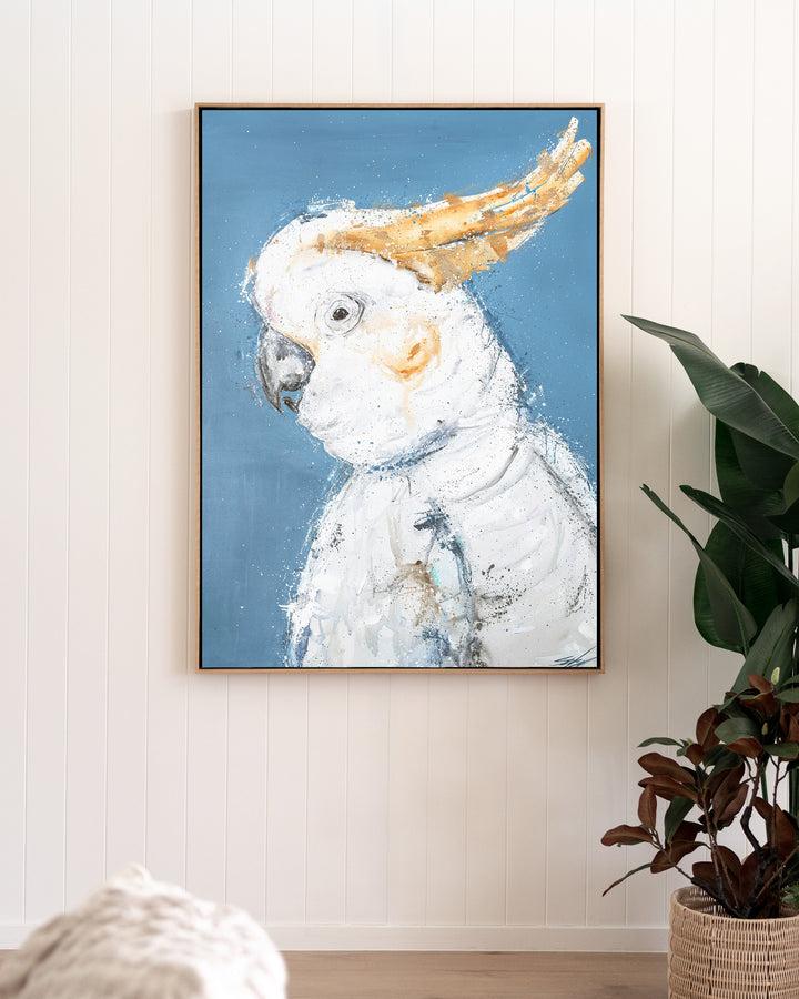 Crested Fiesta – white cockatoo, framed canvas in oak float frame, styled in a living room