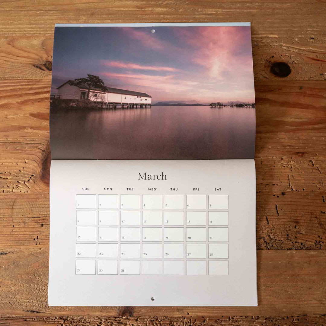 Calendar with March on a wooden surface